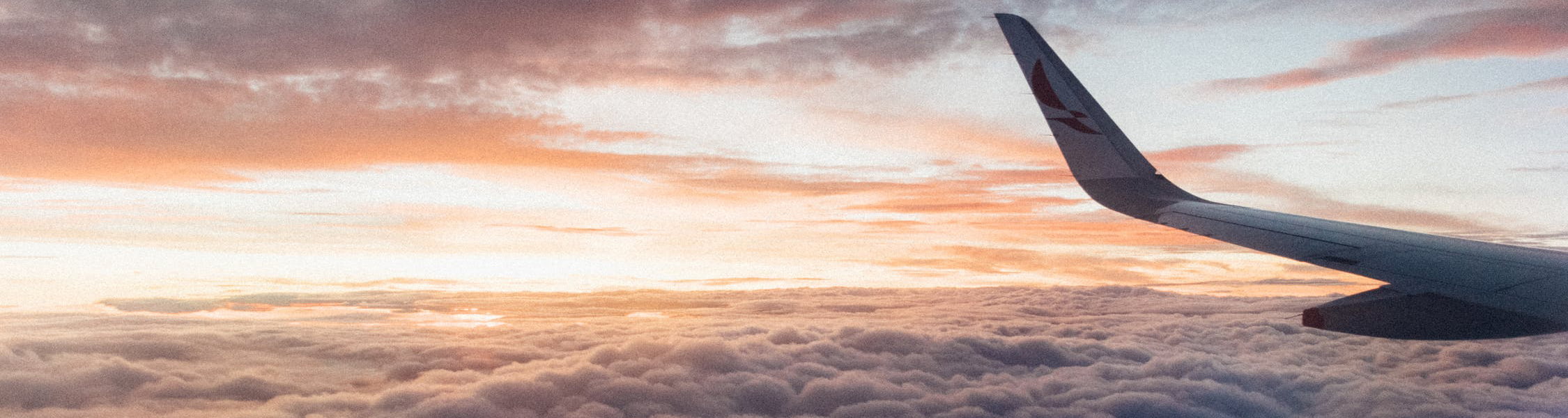 a plane wing in the sky