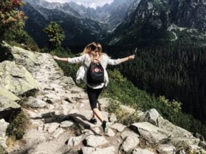 a person standing on a rock