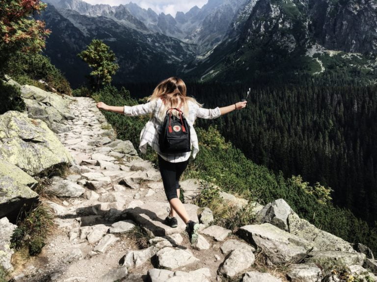 a person standing on a rock