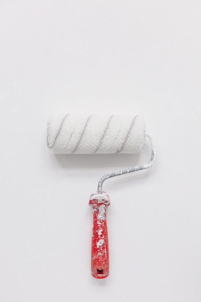 a red and white toothbrush