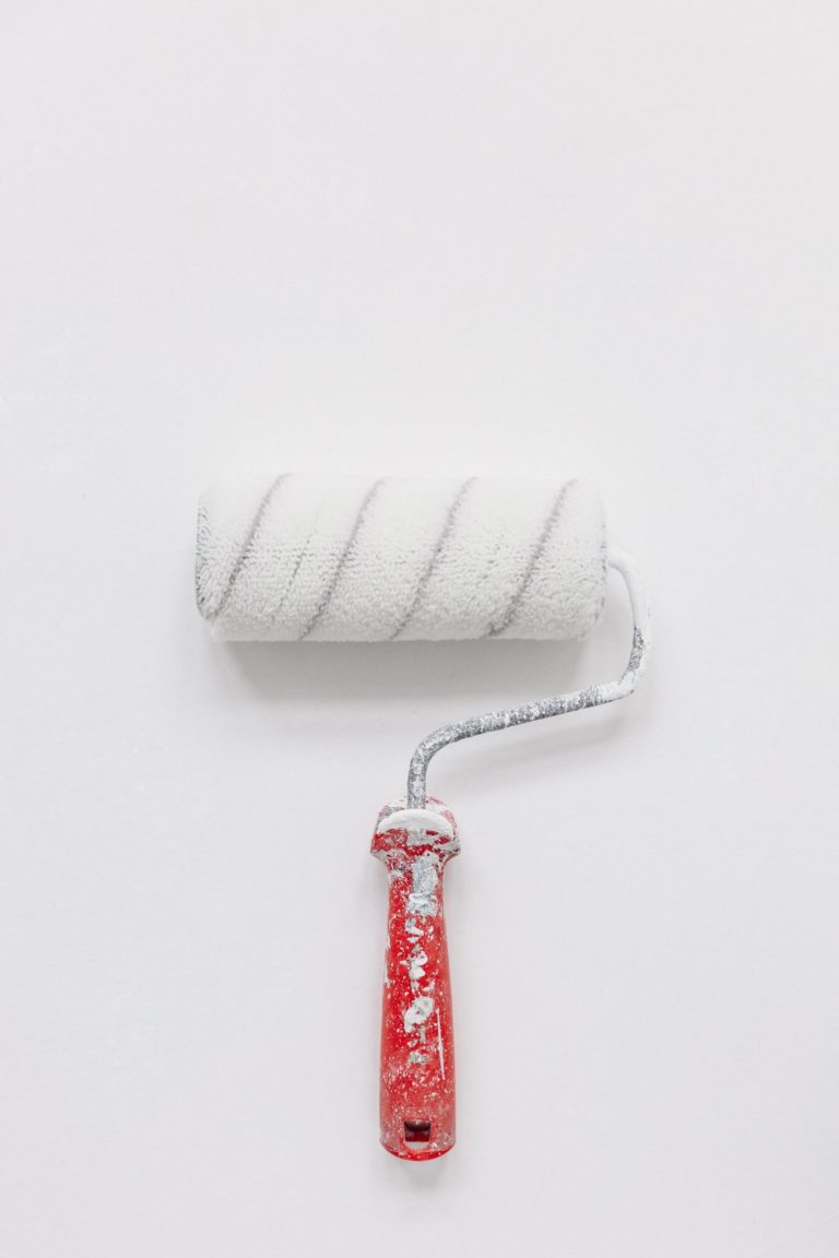 a red and white toothbrush
