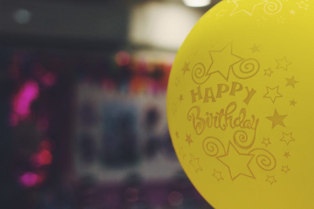 a yellow sign with writing on it