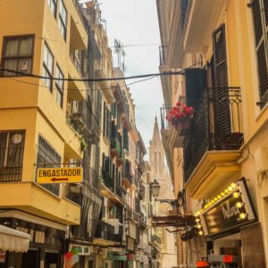 a street with buildings and wires