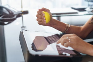 a person holding a yellow apple